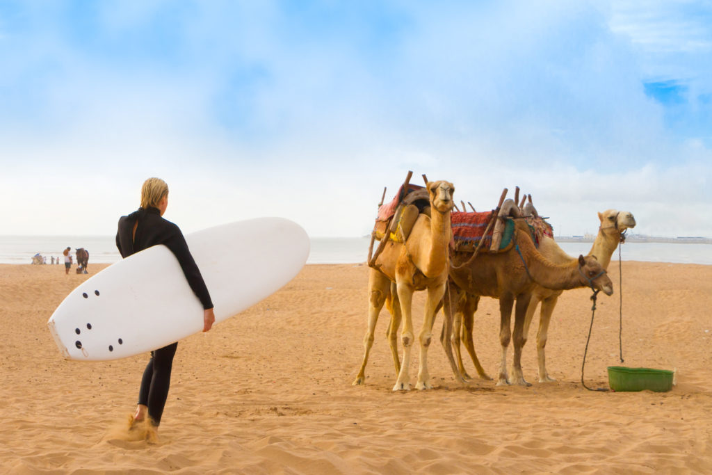 Surfer on the beach at Essaouira, Morocco