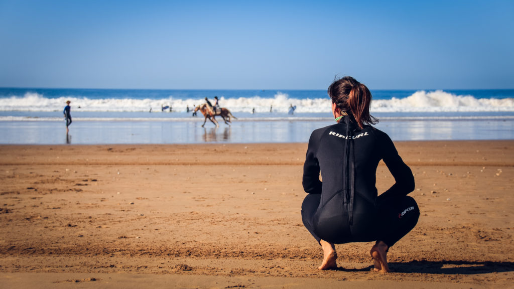 Surfer on the beach in Morocco