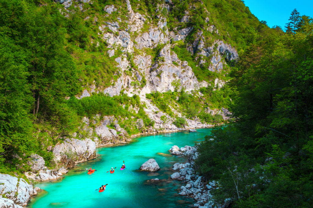 Kayakers on the spectacular turquoise Soca river