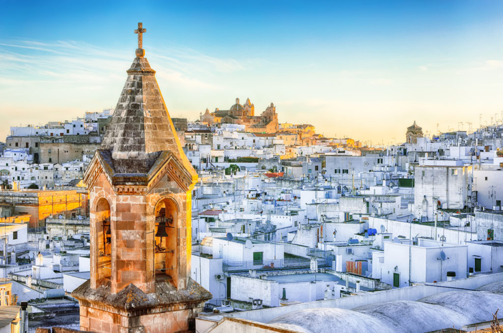 White town Ostuni and cathedral at sunrise