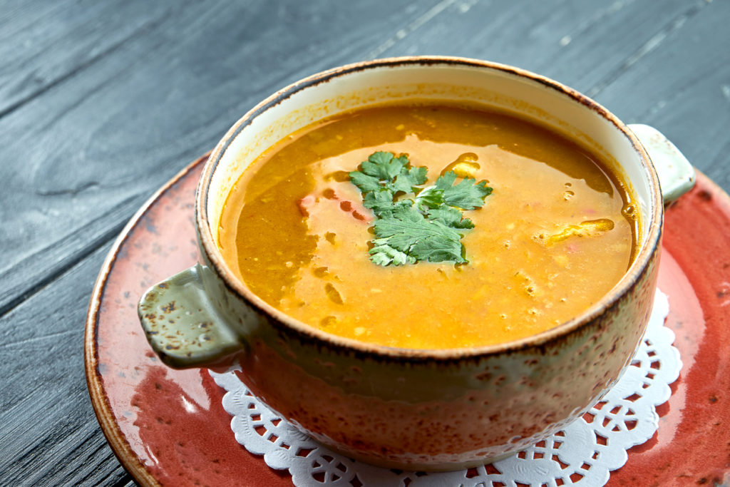 Traditional Moroccan soup - Harira, yellow lentil soup with cilantro