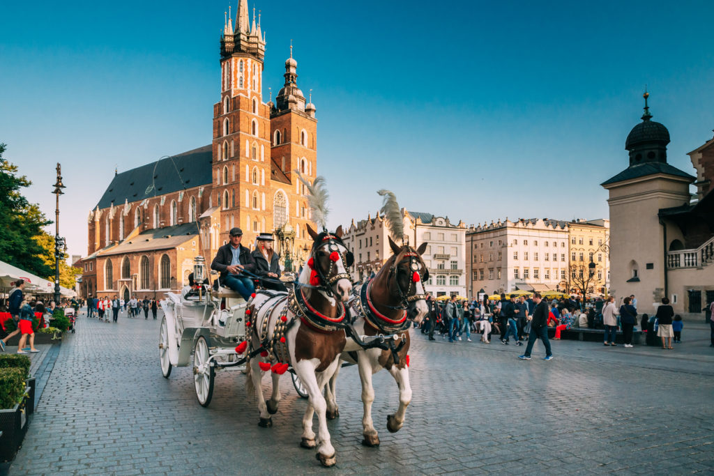 Two Horses In Old-fashioned Coach At Old Town Square