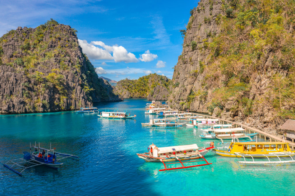 Tour boats by the shore at Coron island