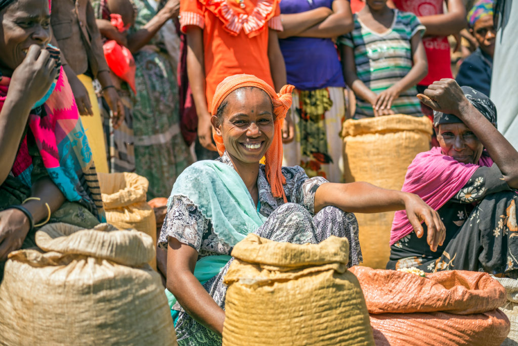 Ethiopian woman selling crops at a local market.