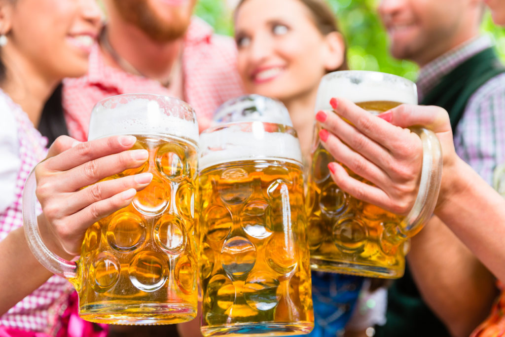 Friends drinking beer in a beer garden in Munich.