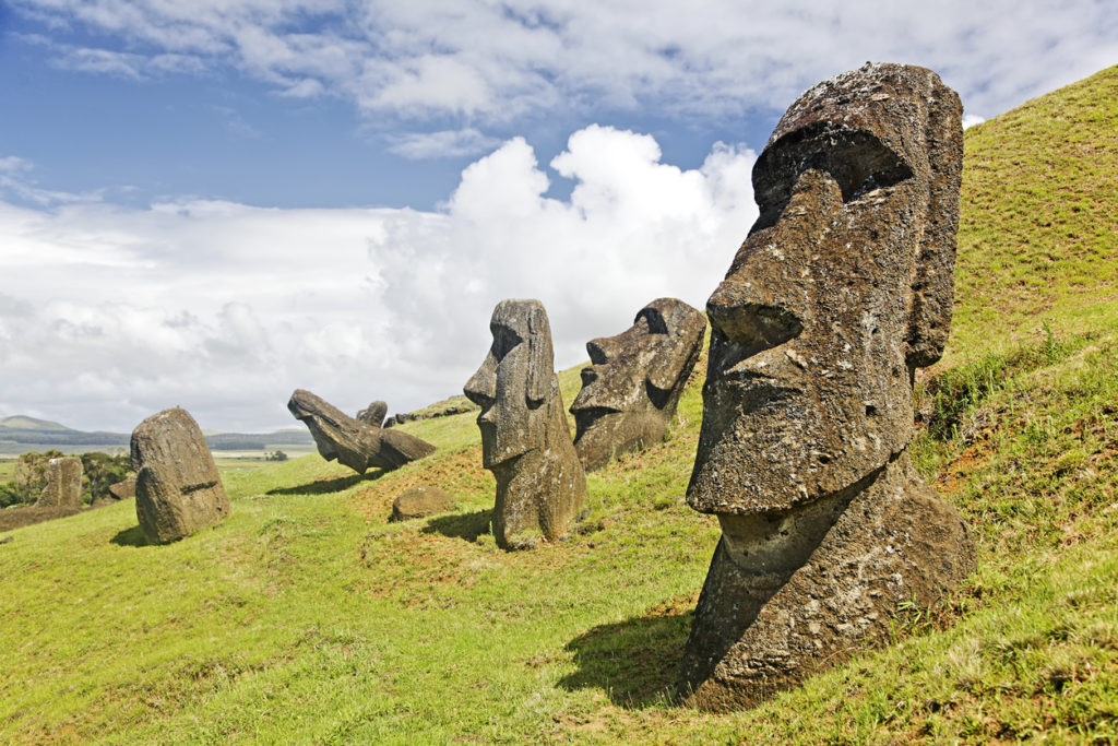 Moais in Rapu Nui National park on the slopes of Rano Raruku volcano on Easter Island, Chile.