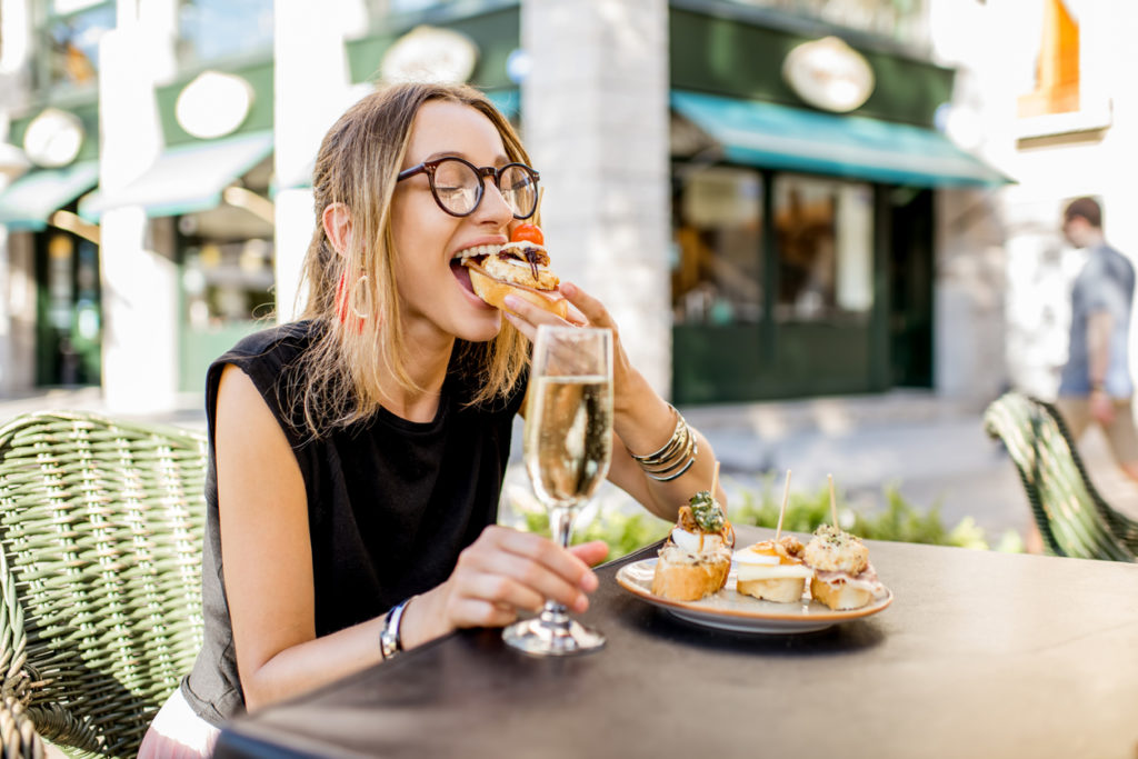 Women enjoying a traditional Spanish skewers in Valencia city