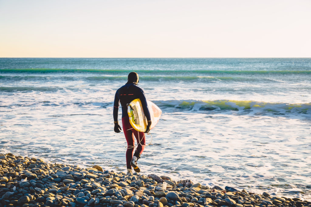 Walking in to the surf in Norway