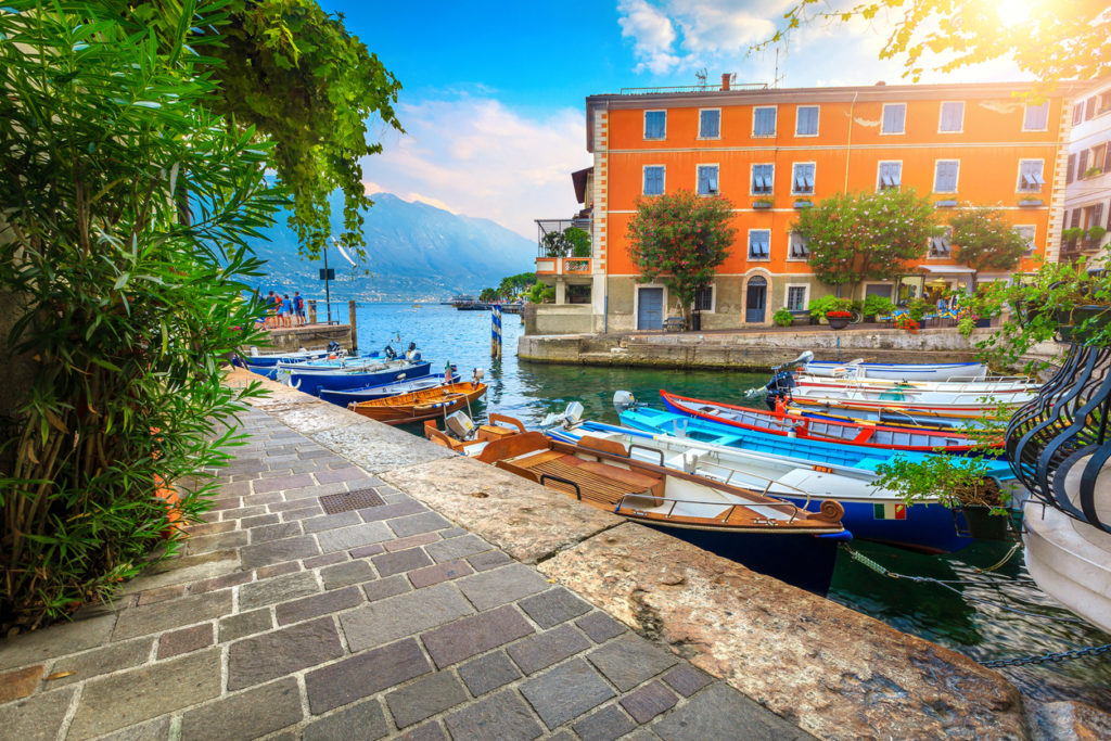 Wooden fishing boats in a harbour in Limone sul Garda.