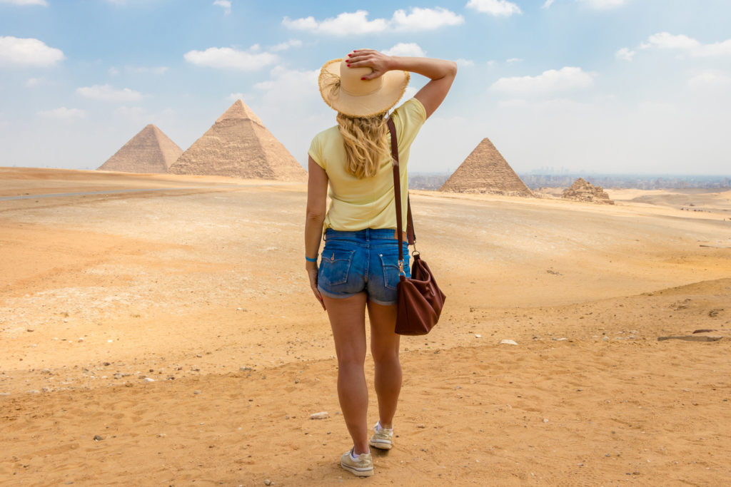 Lady watching the Great Pyramids of Giza
