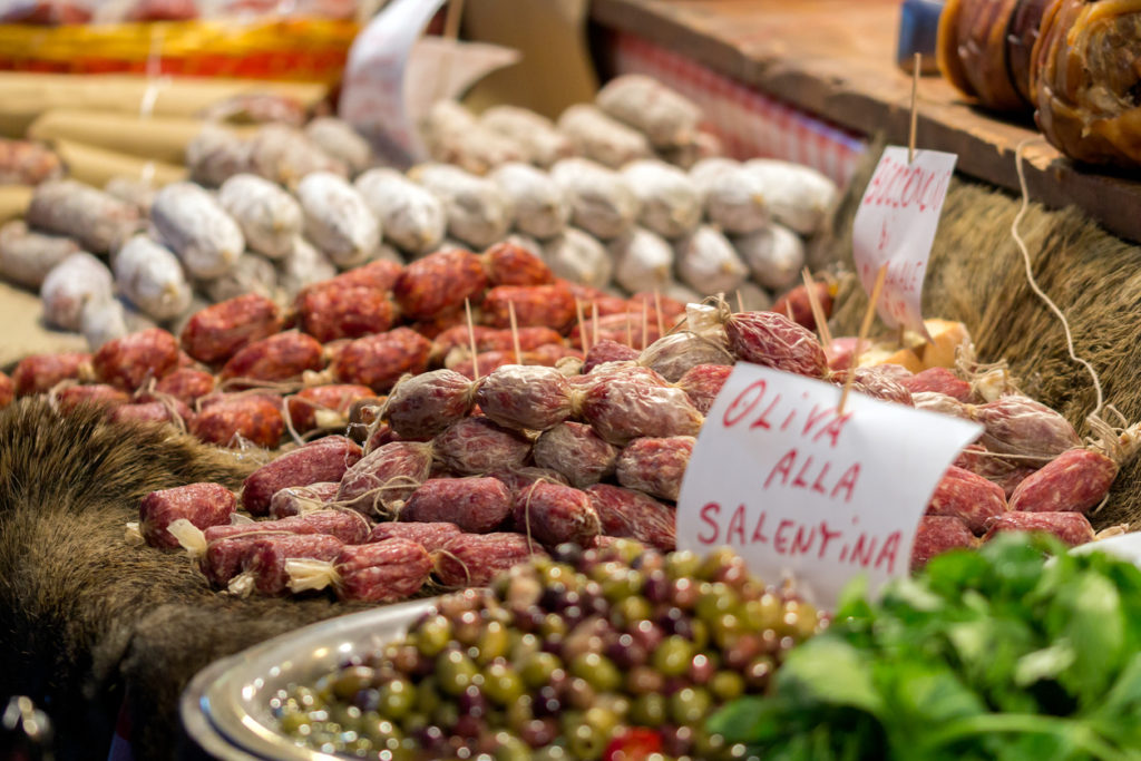 Olive, salami and wild boar at a local market