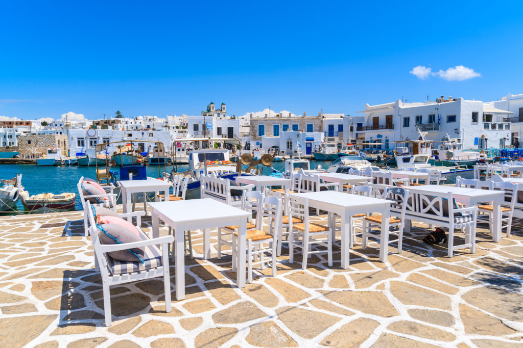 White tavern tables in Naoussa port