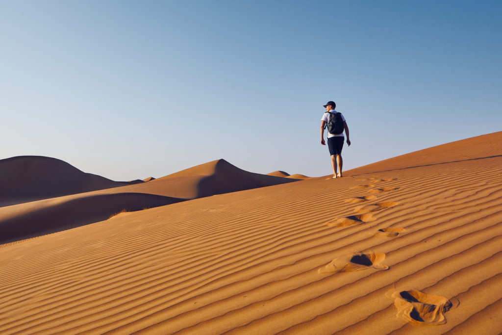 Walking the sand dunes of Wahiba Sands