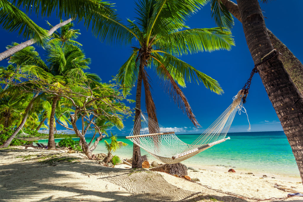 Hammock on the beach in the tropical Fiji Islands
