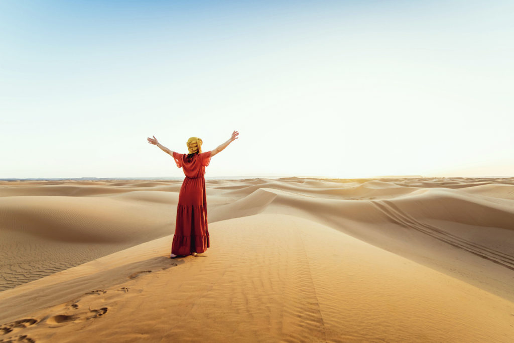 Happy traveler in the desert
