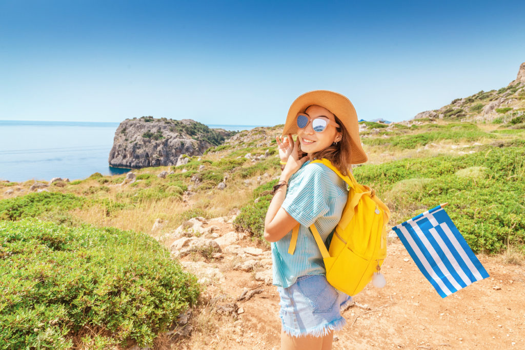 Tourist walking along a footpath in Greece