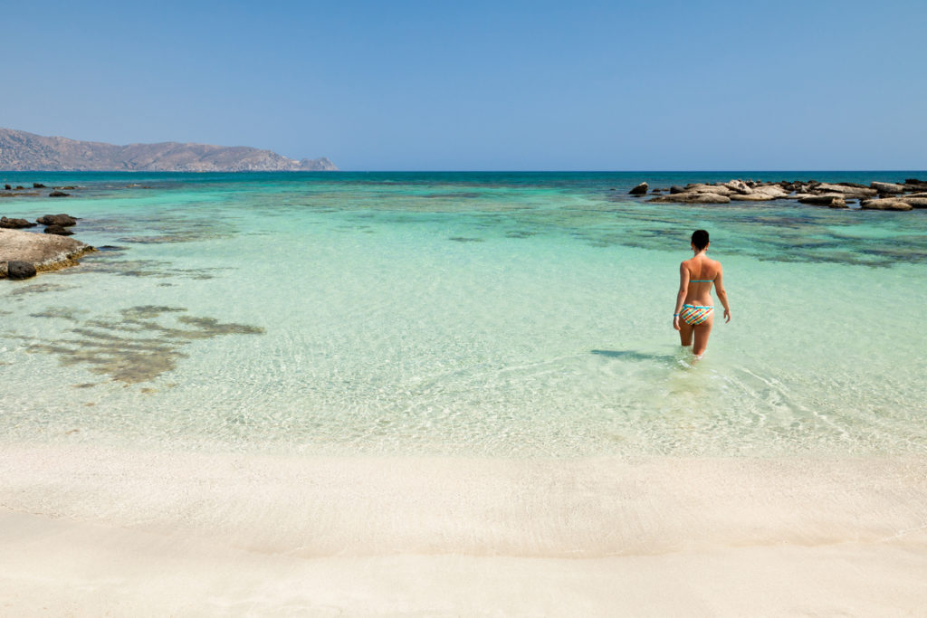 Woman bathing in Elafonisi beach