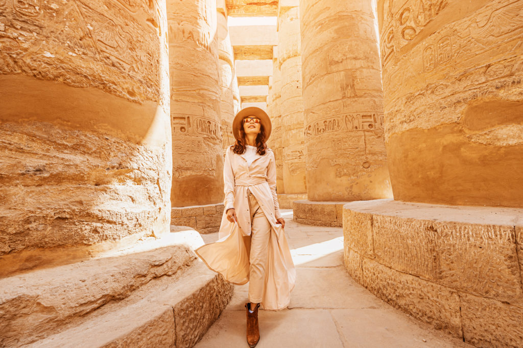 Happy Traveler exploring the ruins of the ancient Karnak Temple