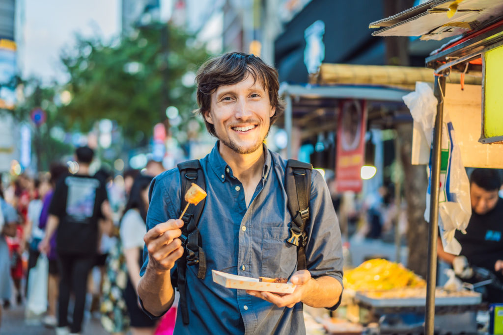 Man eating street food in Seoul