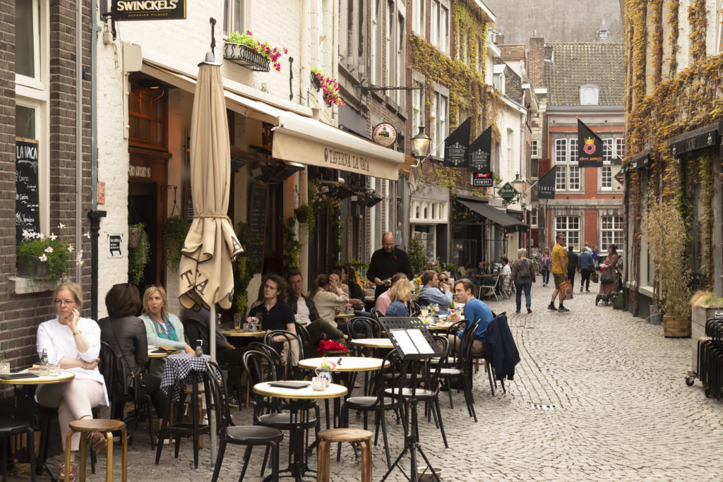Cozy small street with terraces and restaurants in Maastricht