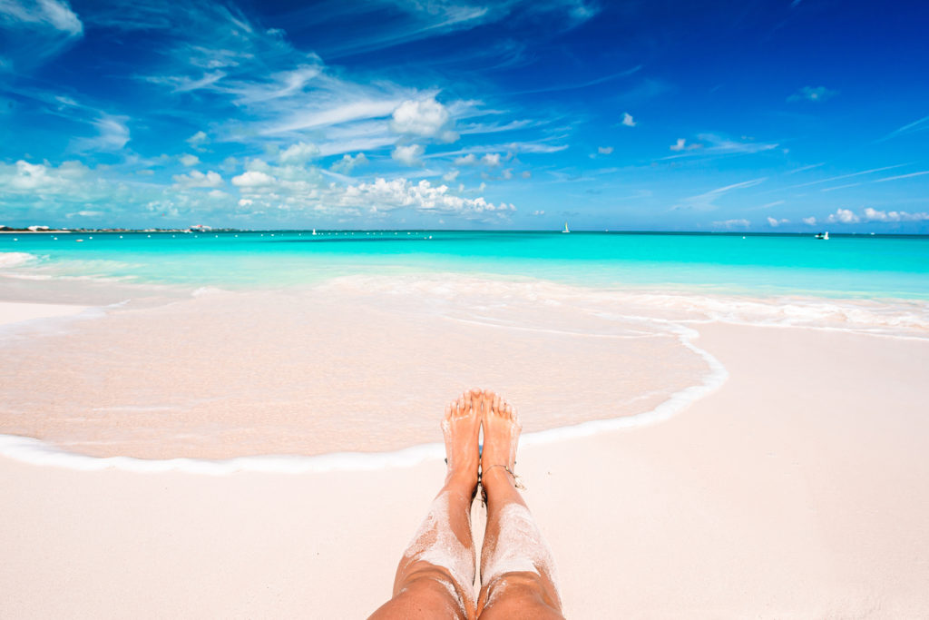 Sunbathing on white sand