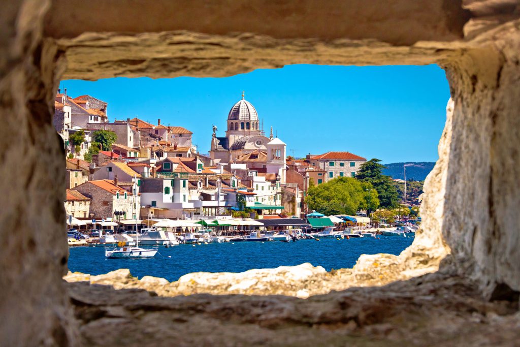 Sibenik waterfront through stone window